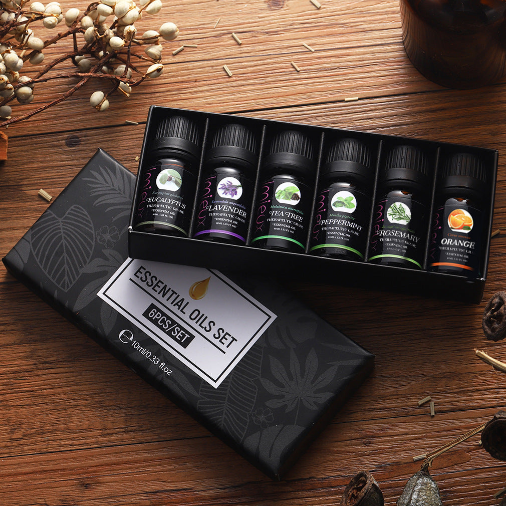 Lumē Ritual Set six pure essential oils gift box, fondo de madera
